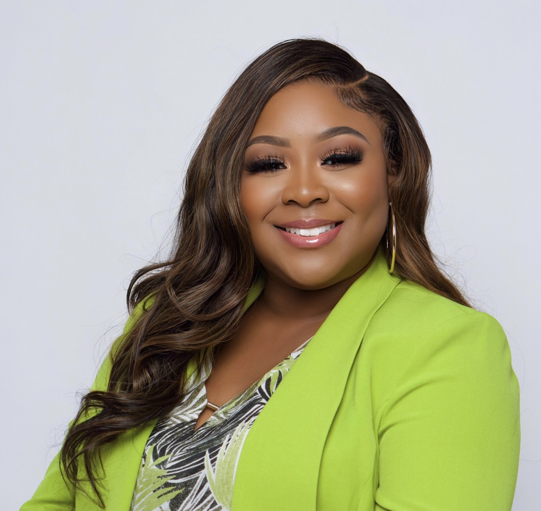 Tanisha Norine Williams, Founder and CEO of NORWILL, seated in her study